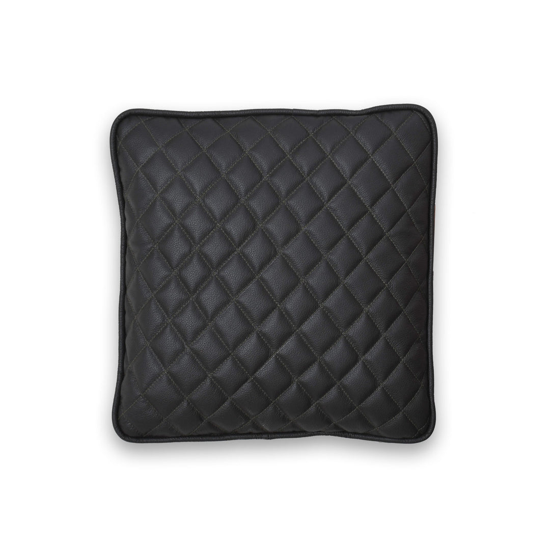Black quilted pillow on a white background
