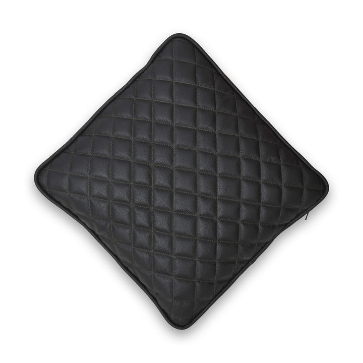 Black quilted pillow on a white background
