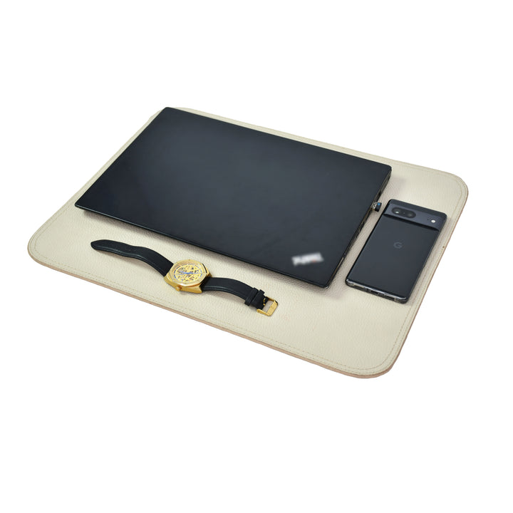 White leather table mat with white contrast stitching on a white background.