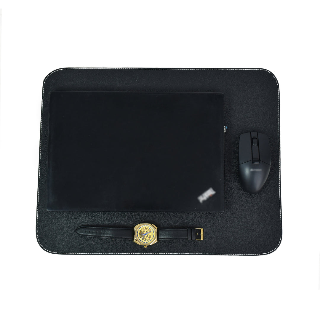 Black leather table mat with white contrast stitching on a white background.