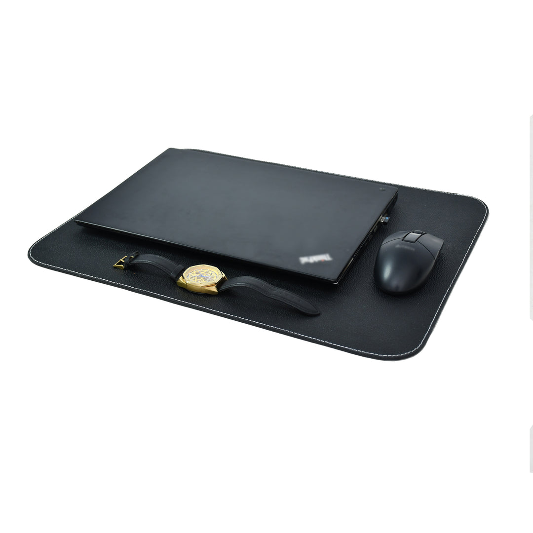 Black leather table mat with white contrast stitching on a white background.