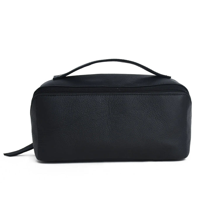 A black pebbled leather cosmetic bag with a top handle and zippered closure, shown against a plain white background.