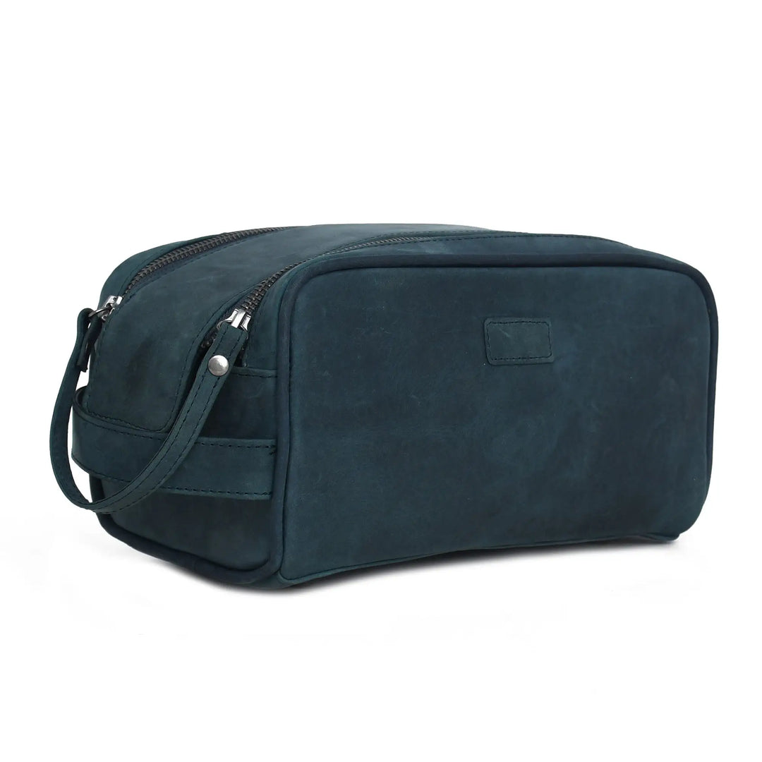Blue toiletry bag with a strap on a white background
