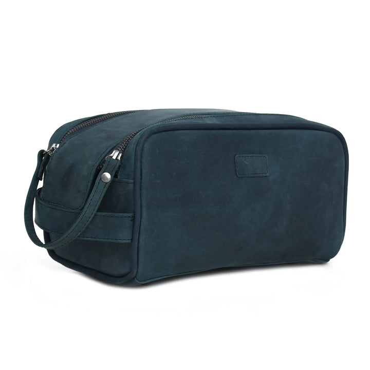 Blue toiletry bag with a strap on a white background