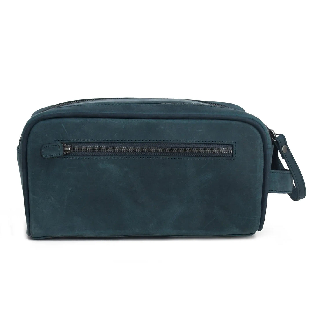 Blue leather toiletry bag with a zipper on a white background