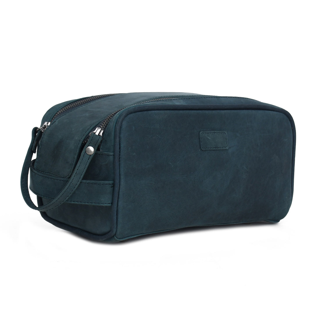 Blue toiletry bag with a strap on a white background