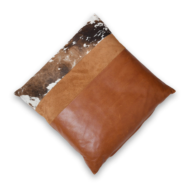 Decorative pillow with brown leather and cowhide pattern on a white background

