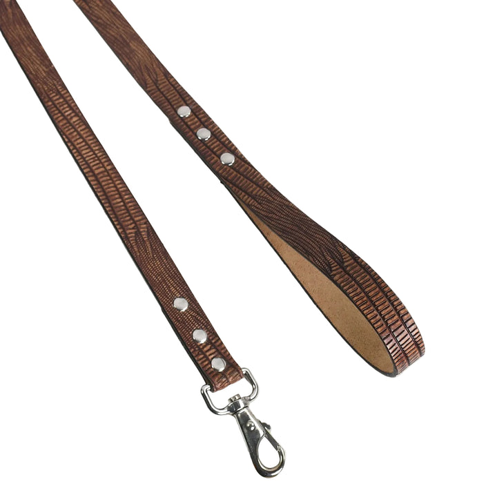 Brown textured leather dog leash with metal clip on a white background


