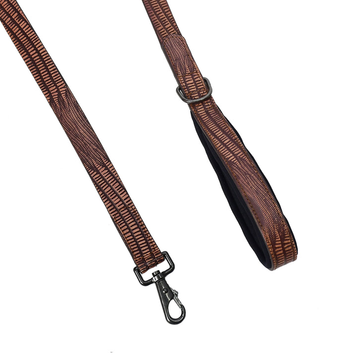 Brown woven strap with metal clasp on a white background

