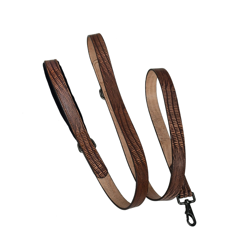 Brown leather strap with a metal clasp on a white background

