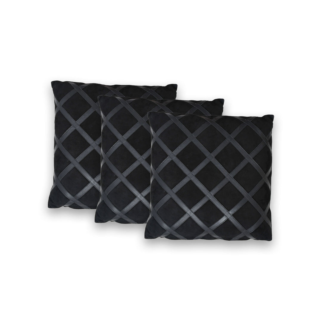 Three black pillows with a geometric pattern on a white background

