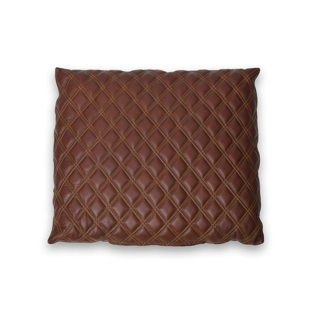 Brown quilted pillow on a white background

