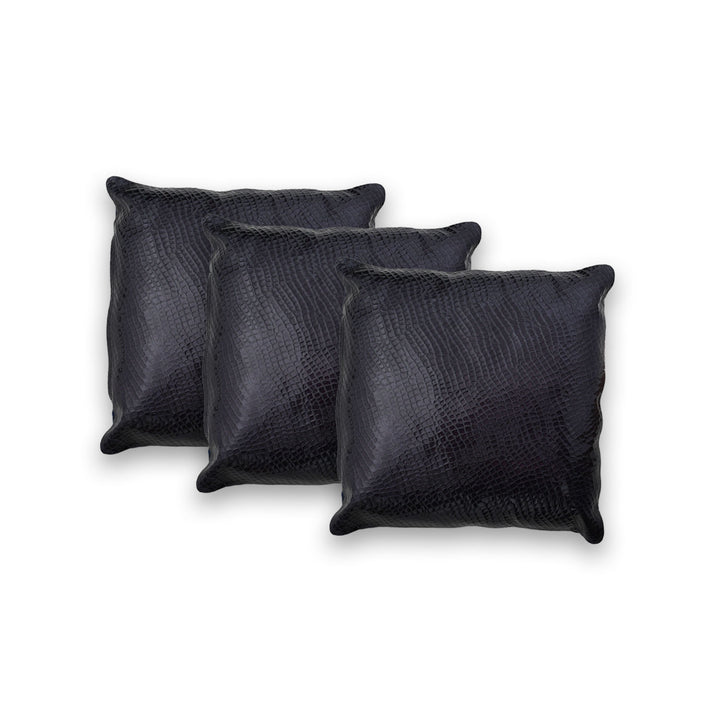 Three black textured pillows on a white background

