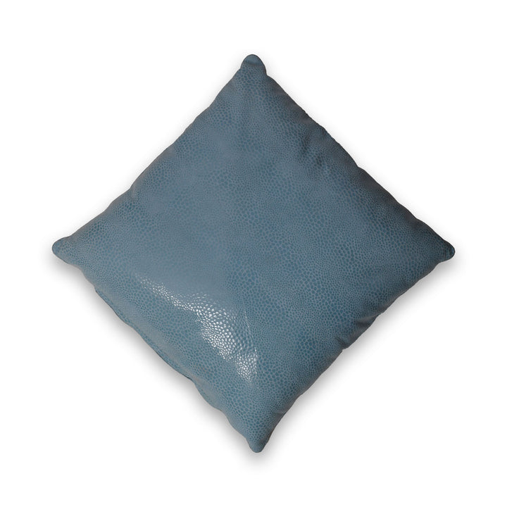 Blue textured pillow on a white background

