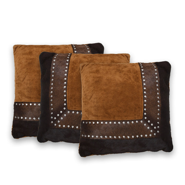 Two brown and black patterned cushion with studded details on a white background