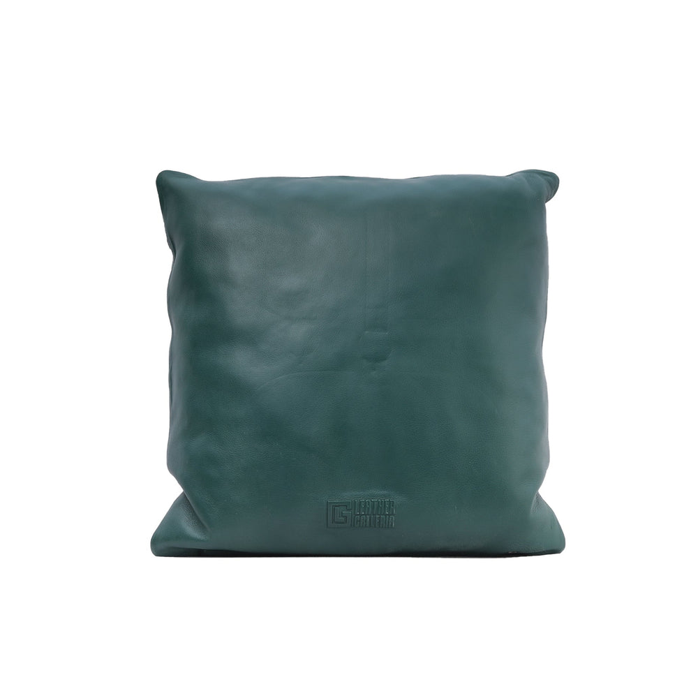 Teal leather pillow on a white background

