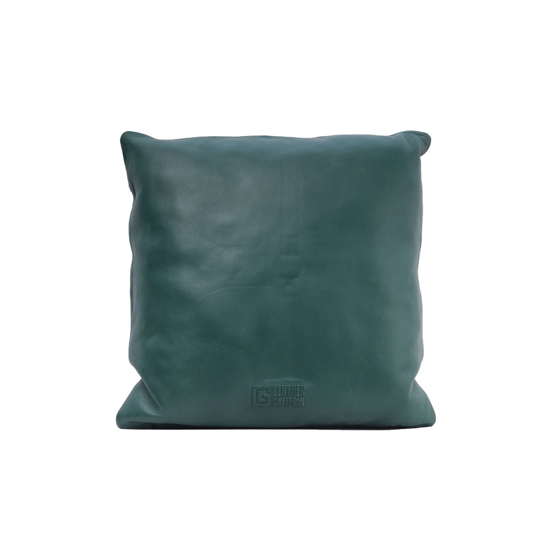 Teal leather pillow on a white background

