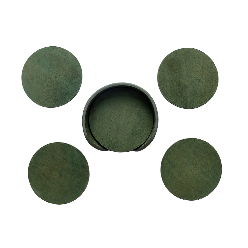 Set of four green circular coasters with a central coaster containing a black substance on a white background