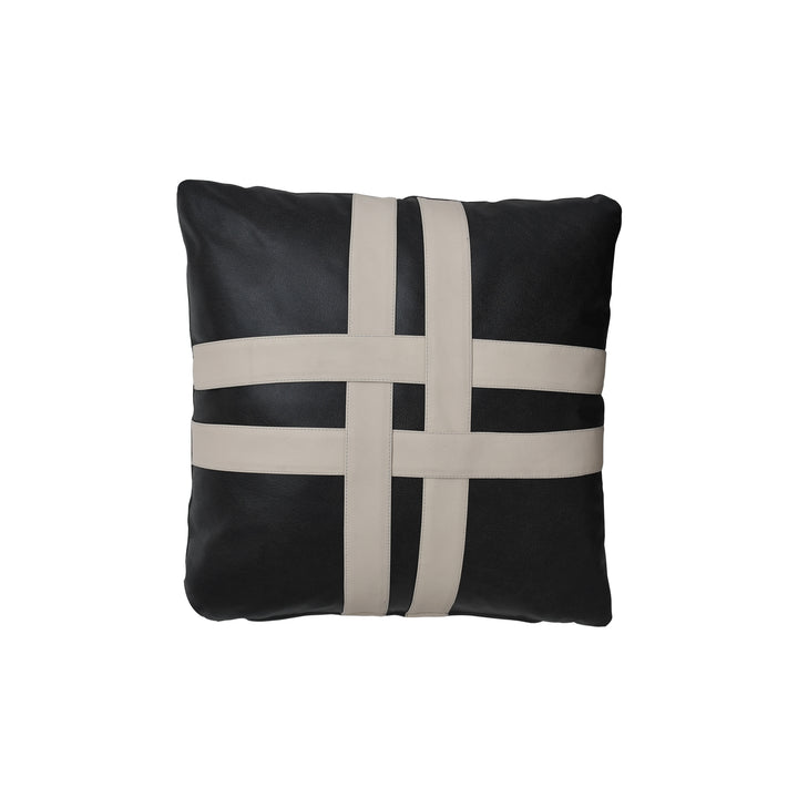 Black and beige cross-patterned pillow on a white background