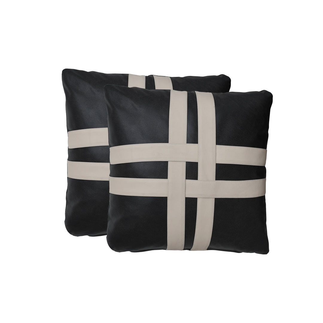 Two black pillows with beige woven patterns on a white background