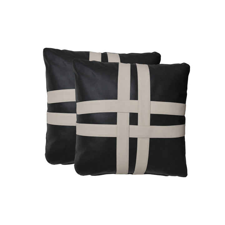 Two black pillows with beige woven patterns on a white background