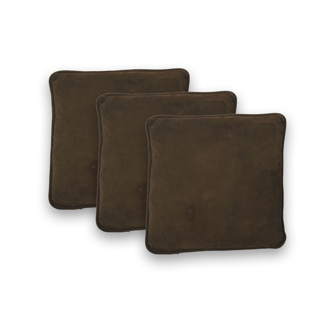 Three brown square cushions on a white background
