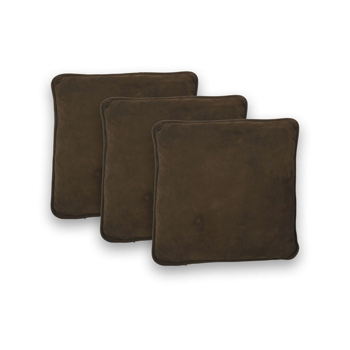 Three brown square cushions on a white background