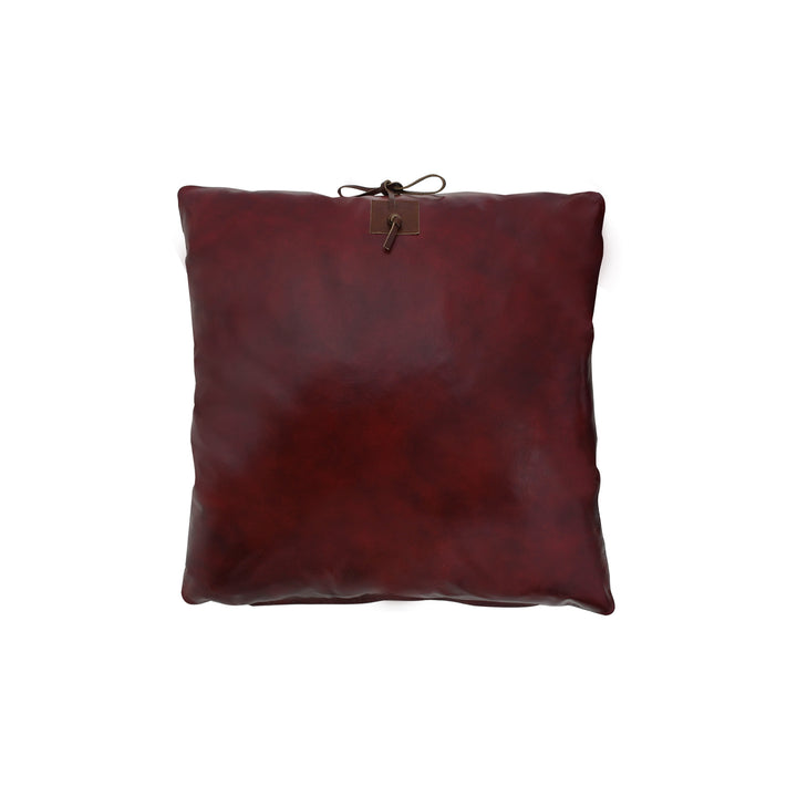 Brown leather pillow on a white background