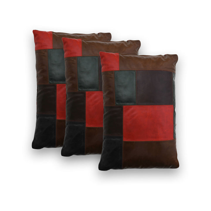 Set of four patchwork pillows with brown, red, and black squares on a white background