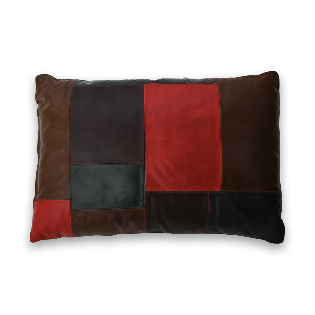 Patchwork pillow with brown, black, and red sections on a white background