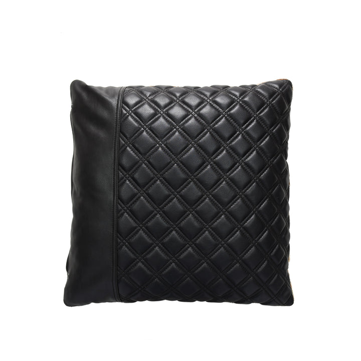 Black quilted pillow on a white background