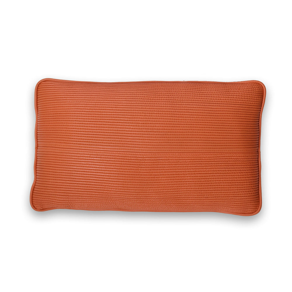 Orange textured rectangular pillow on a white background