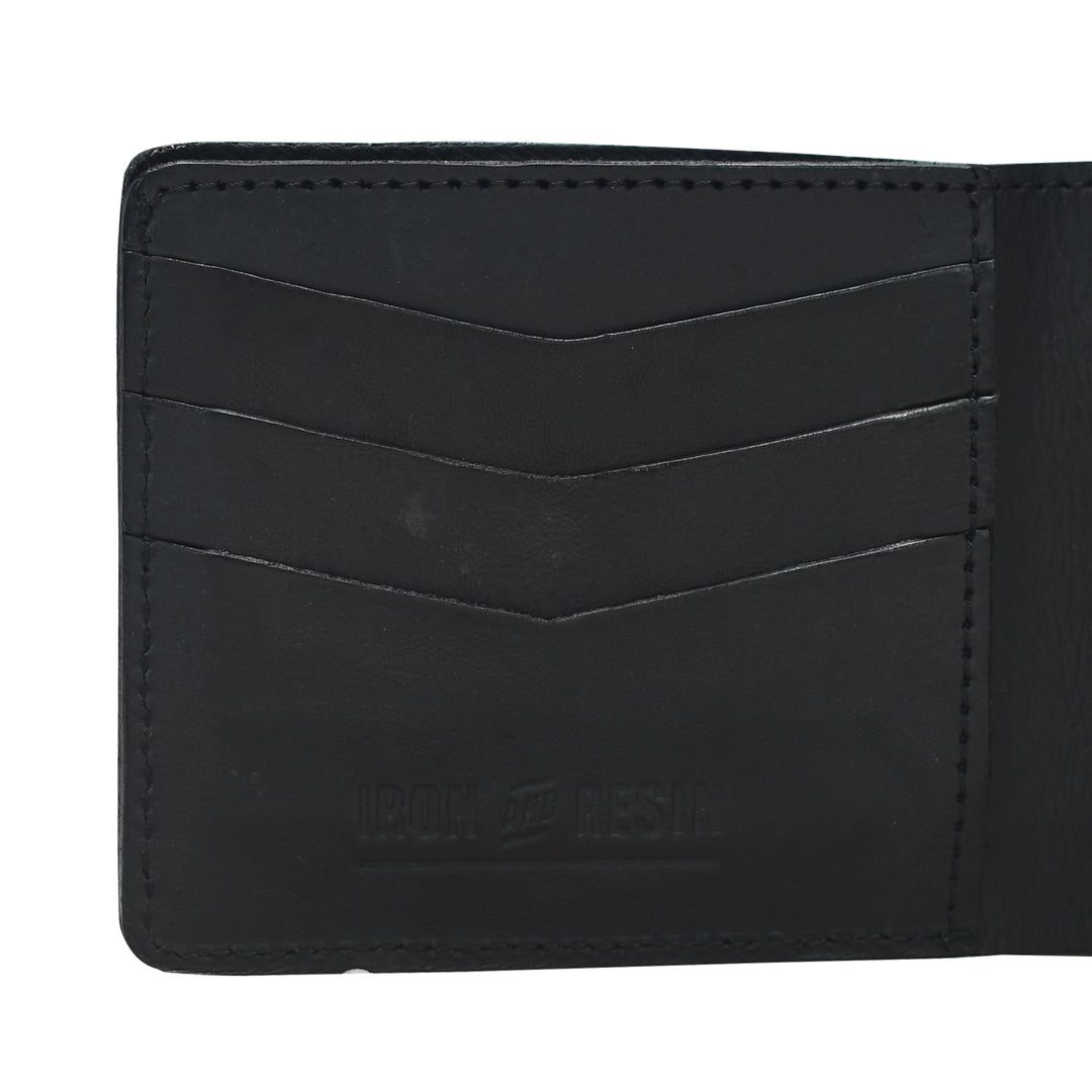 Black leather wallet with visible brand name on a white background