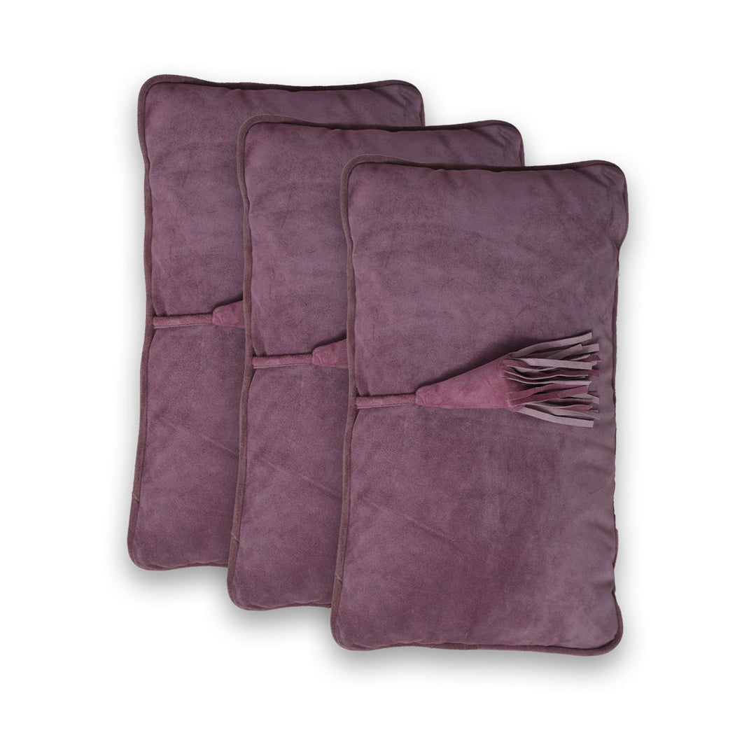 Three purple heating pads on a white background