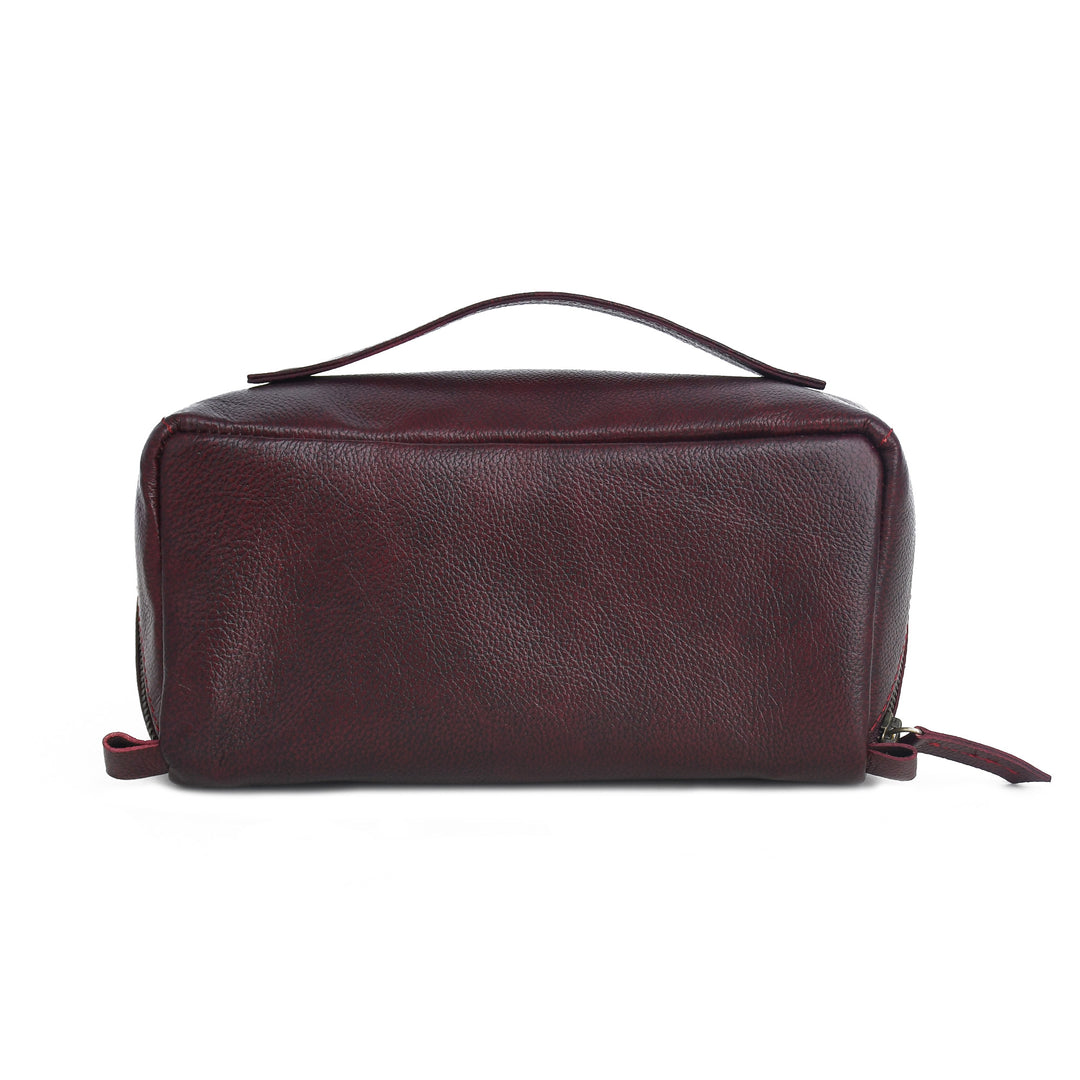 Brown leather toiletry bag on a white background