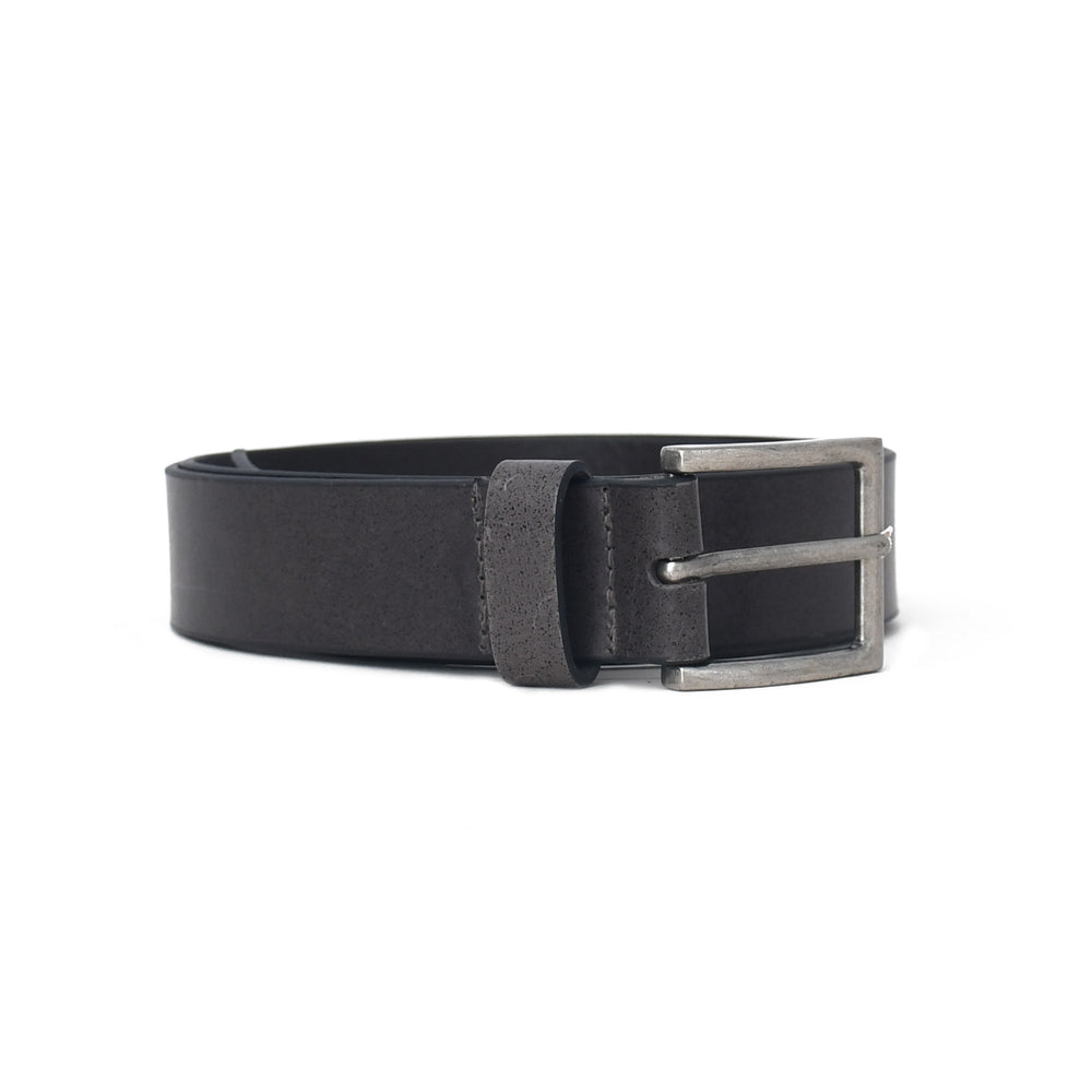 Black leather belt with a silver buckle on a white background