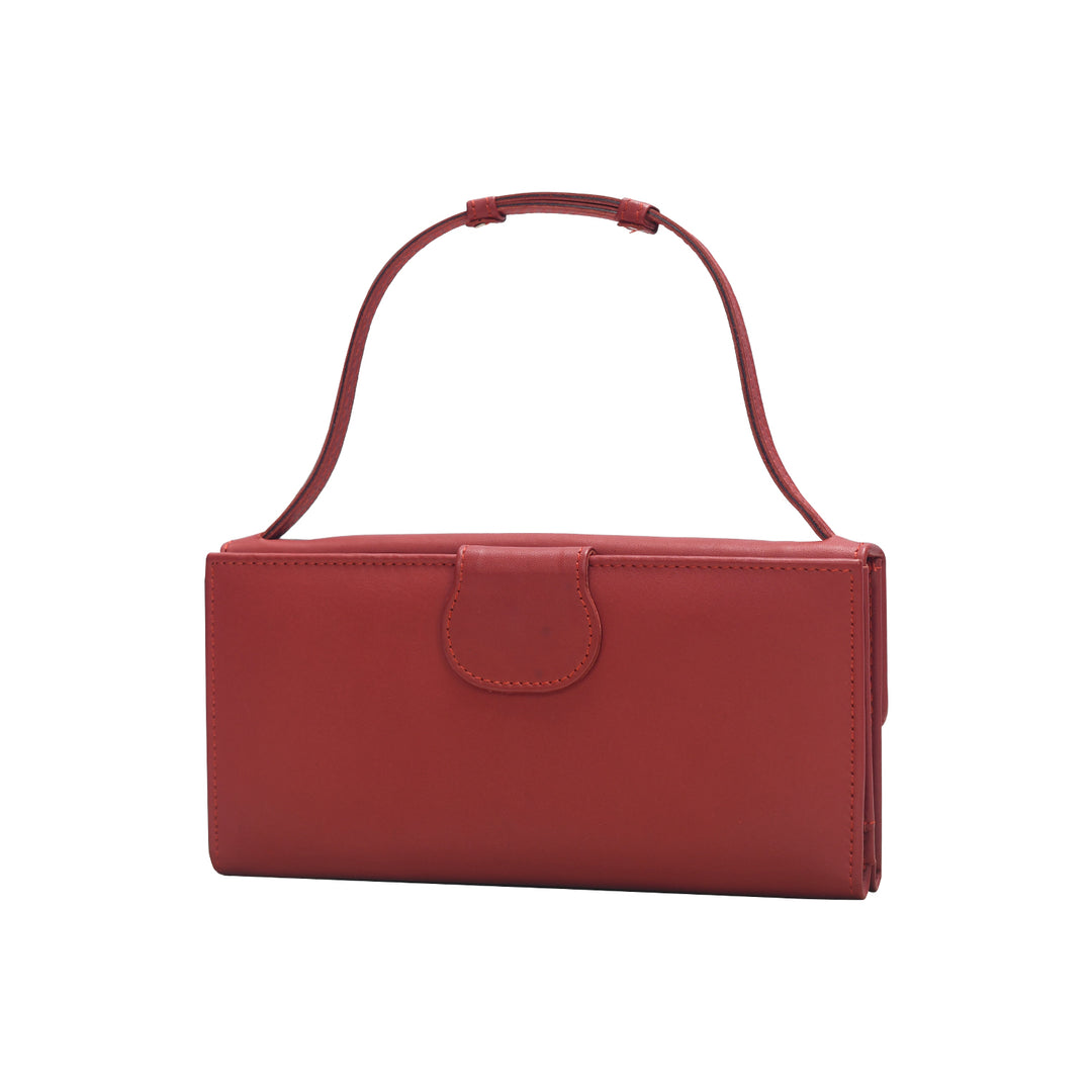 Red handbag with a strap on a white background