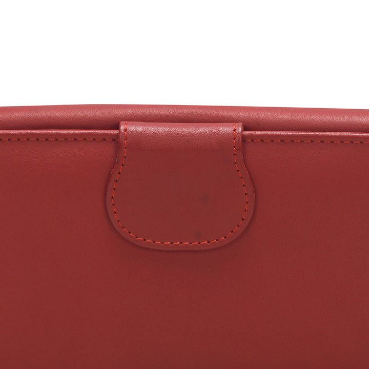 Close-up of a red leather product with a visible brand logo.