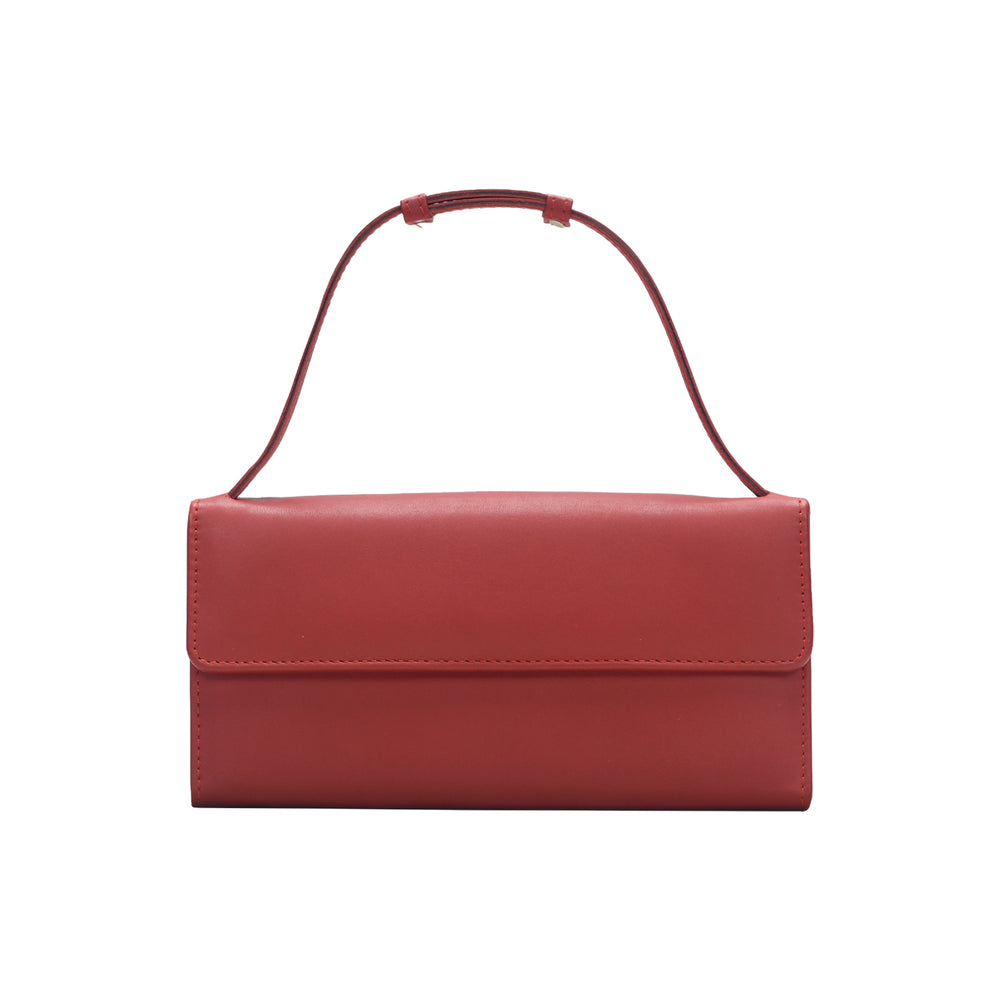 Red handbag with a strap on a white background