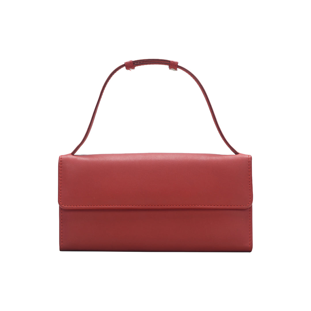 Red handbag with a strap on a white background