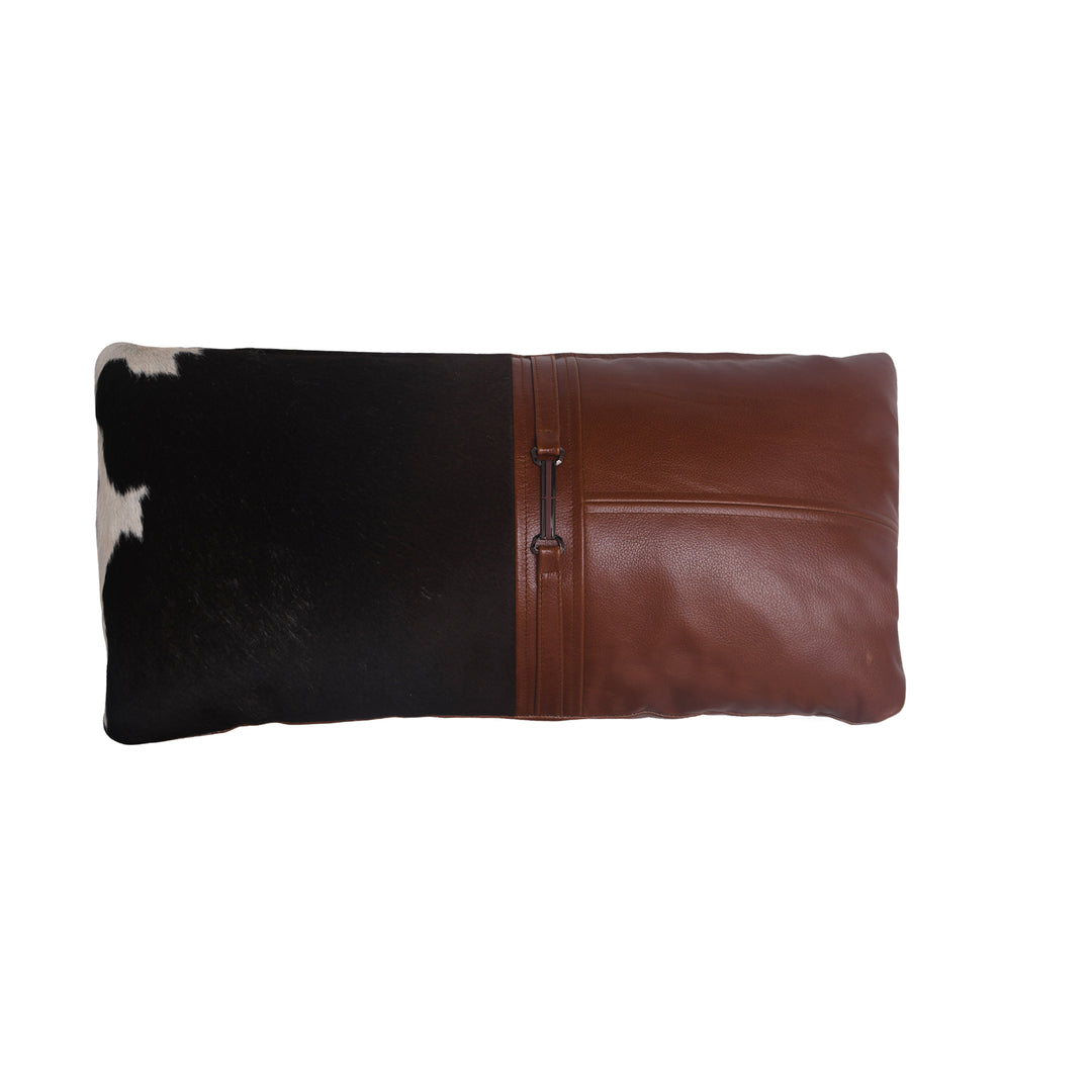 Cushion with cowhide leather and brown leather trim on a white background