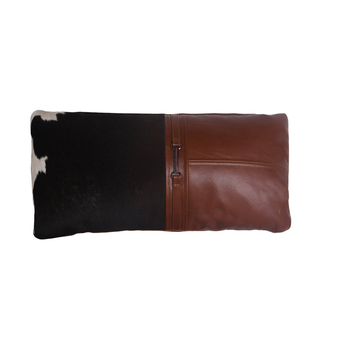 Cushion with cowhide leather and brown leather trim on a white background