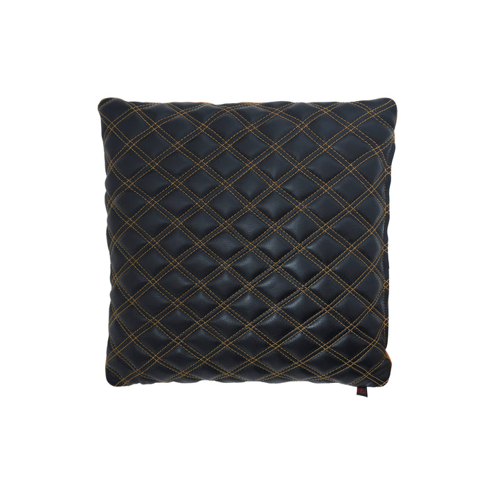 Black quilted pillow with gold stitching on a white background