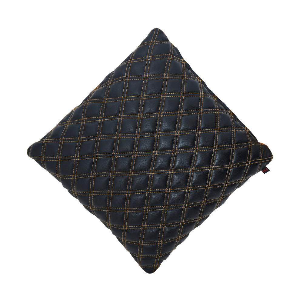Black quilted pillow on a white background
