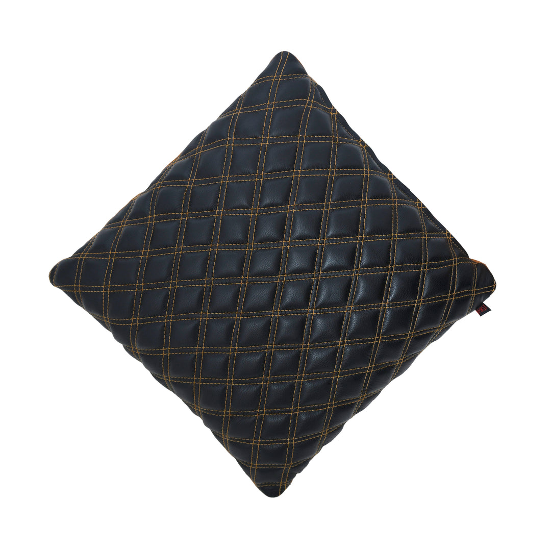 Black quilted pillow on a white background