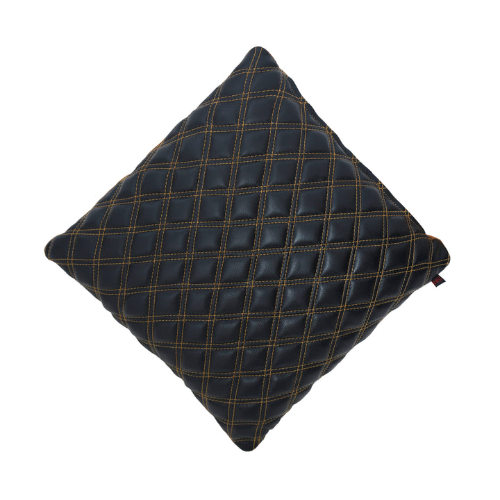 Black quilted pillow on a white background