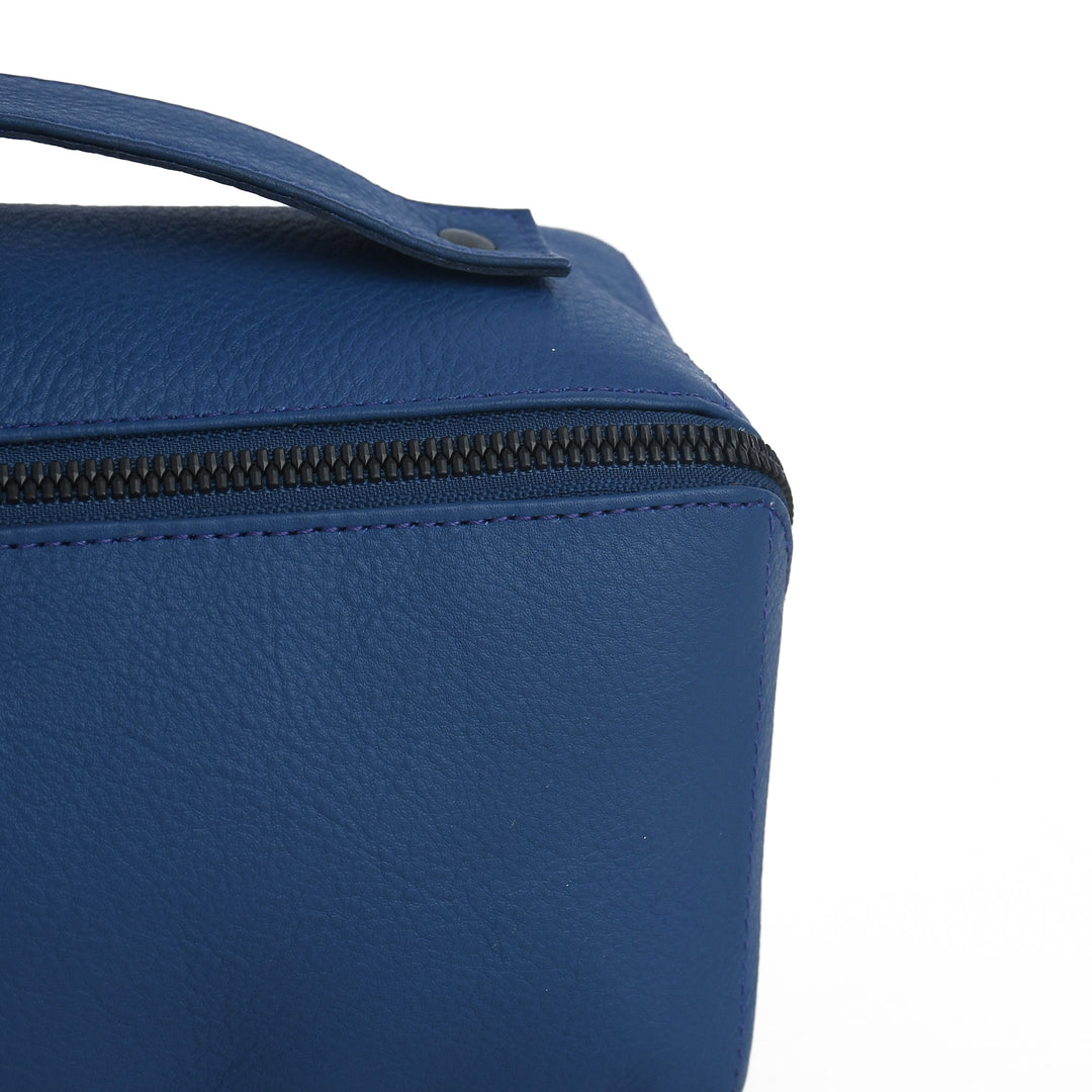 Blue textured bag with a zipper on a white background