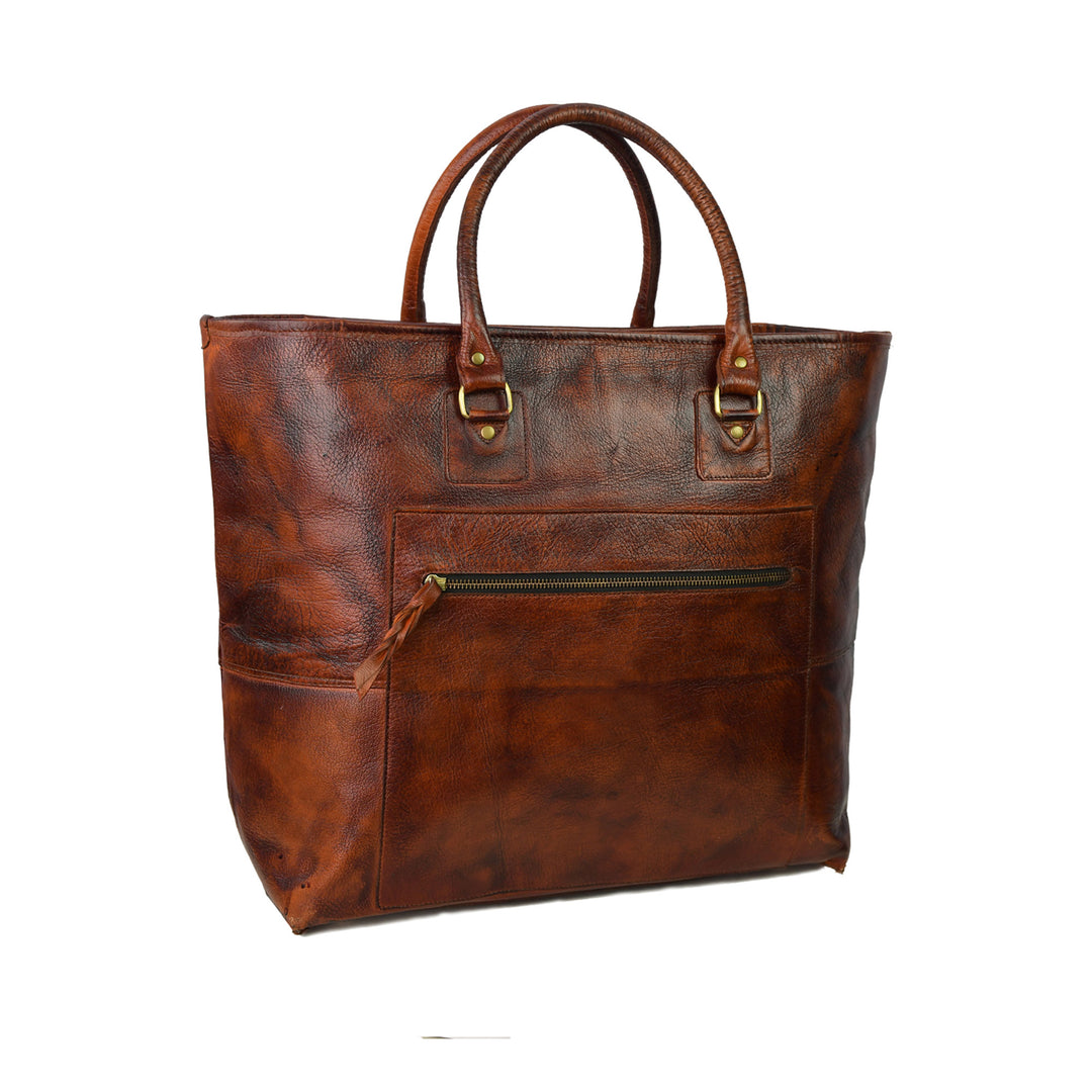 Brown leather tote bag with gold accents on a white background