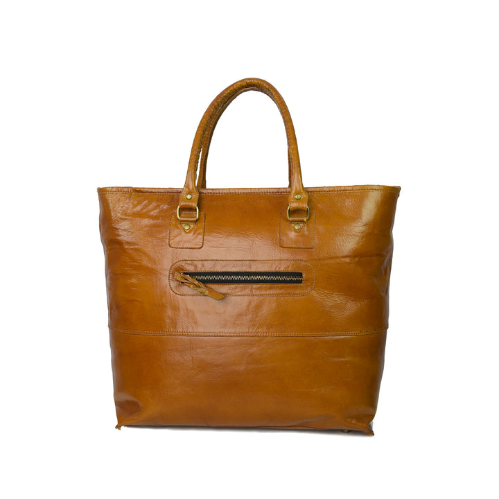 Brown leather tote bag with gold hardware on a white background