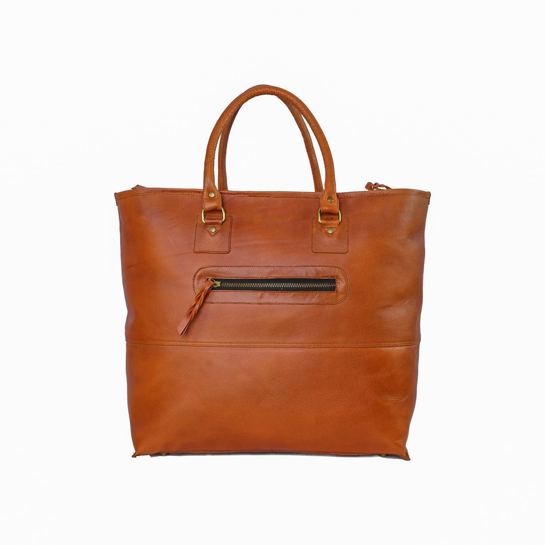 Brown leather tote bag with gold zipper on a white background